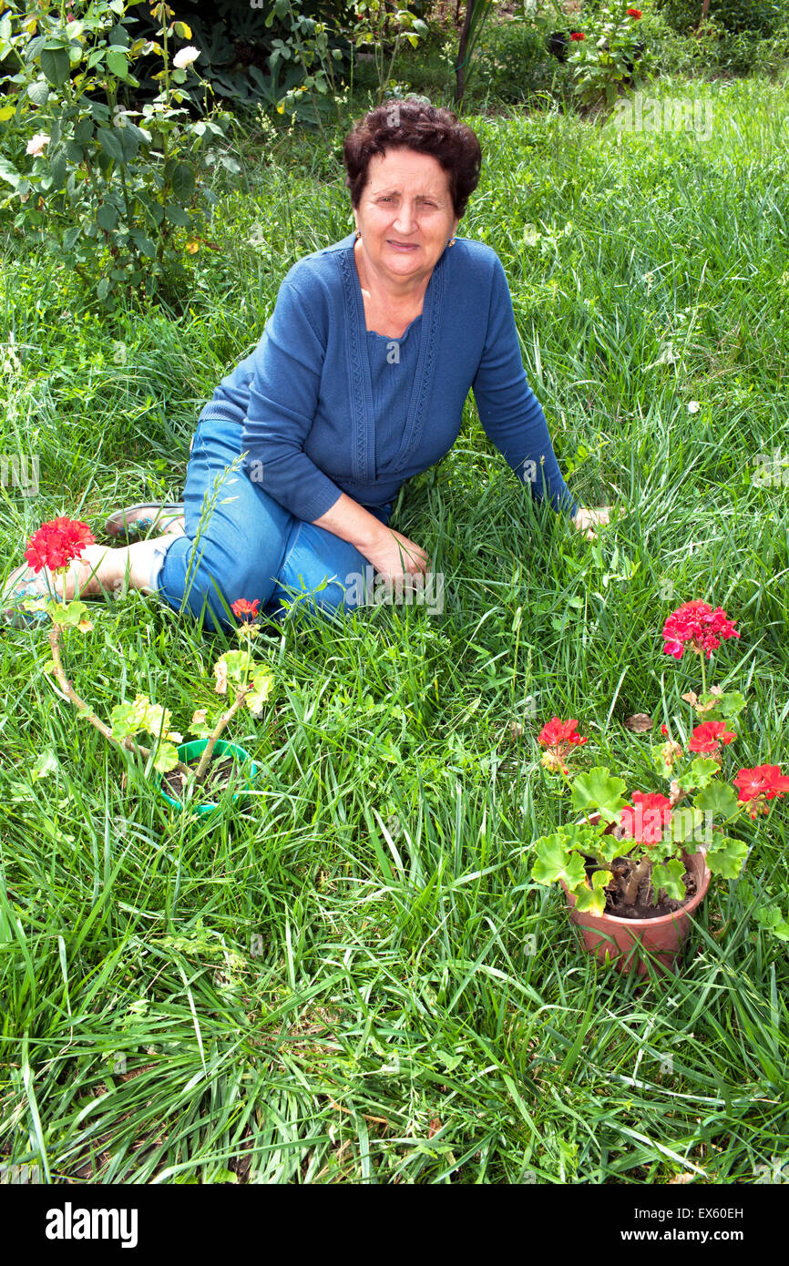 Senior Woman In Her Garden Stock Photo