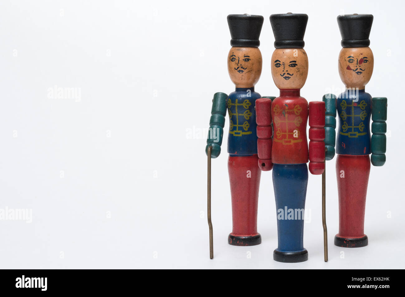 Three Wooden Antique Vintage Red  Blue Green Toy Soldiers White Background Stock Photo
