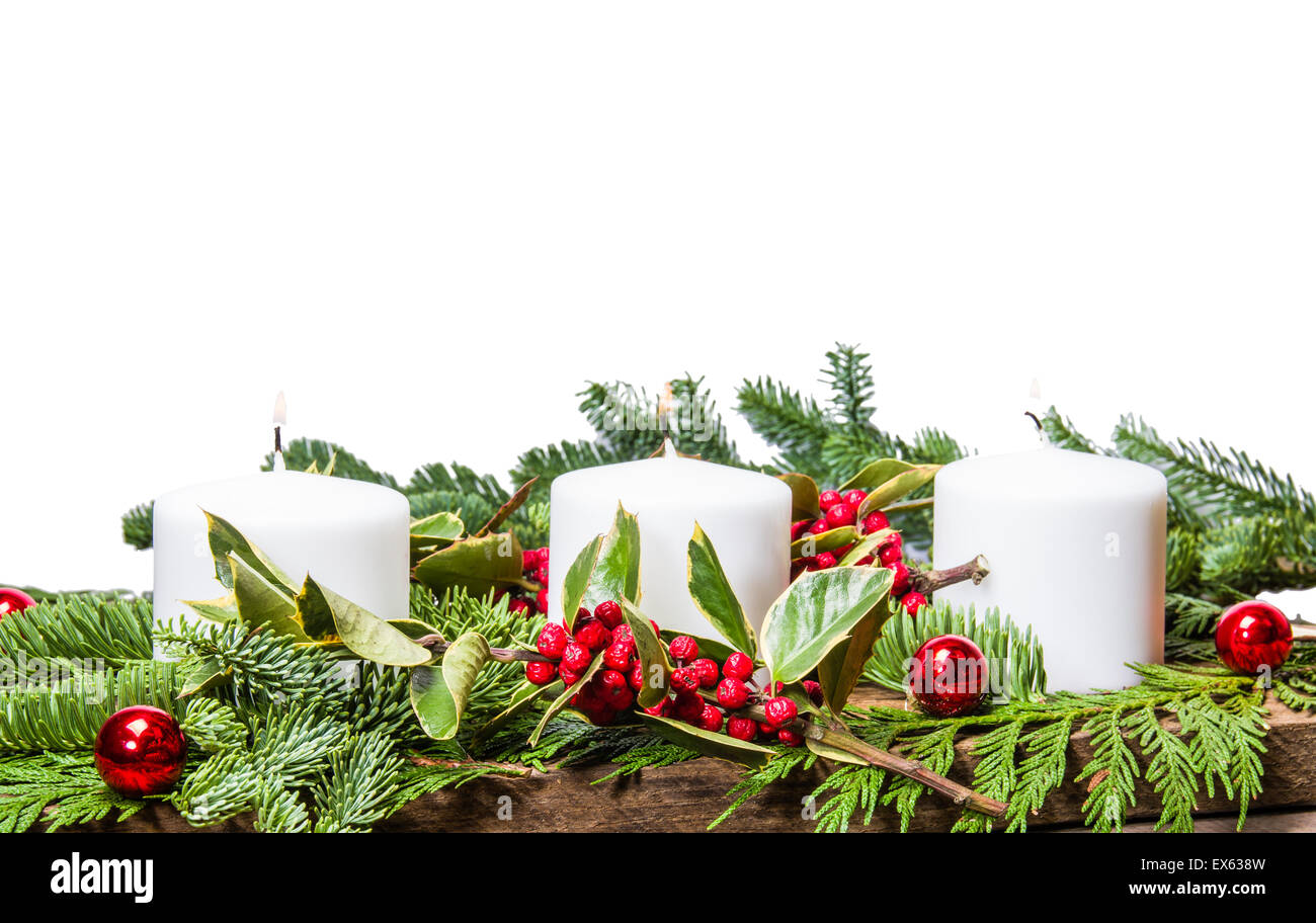 Christmas centerpiece with white candles and isolated background Stock Photo
