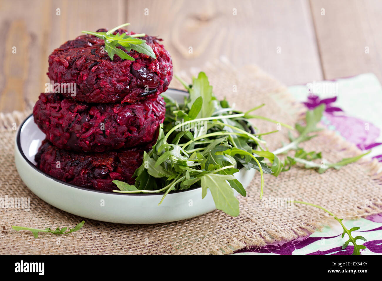 Beetroot vegan burgers with rice and red beans Stock Photo