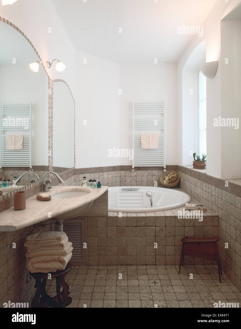interior view of classic bathroom with tile floor overlooking on bathtub Stock Photo