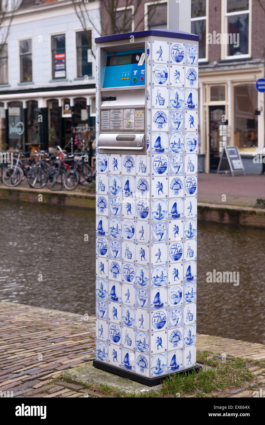 Europe, The Netherlands, South Holland, Delft, parking meter covered with plastic film with the design of the Delft Blue tiles. Stock Photo