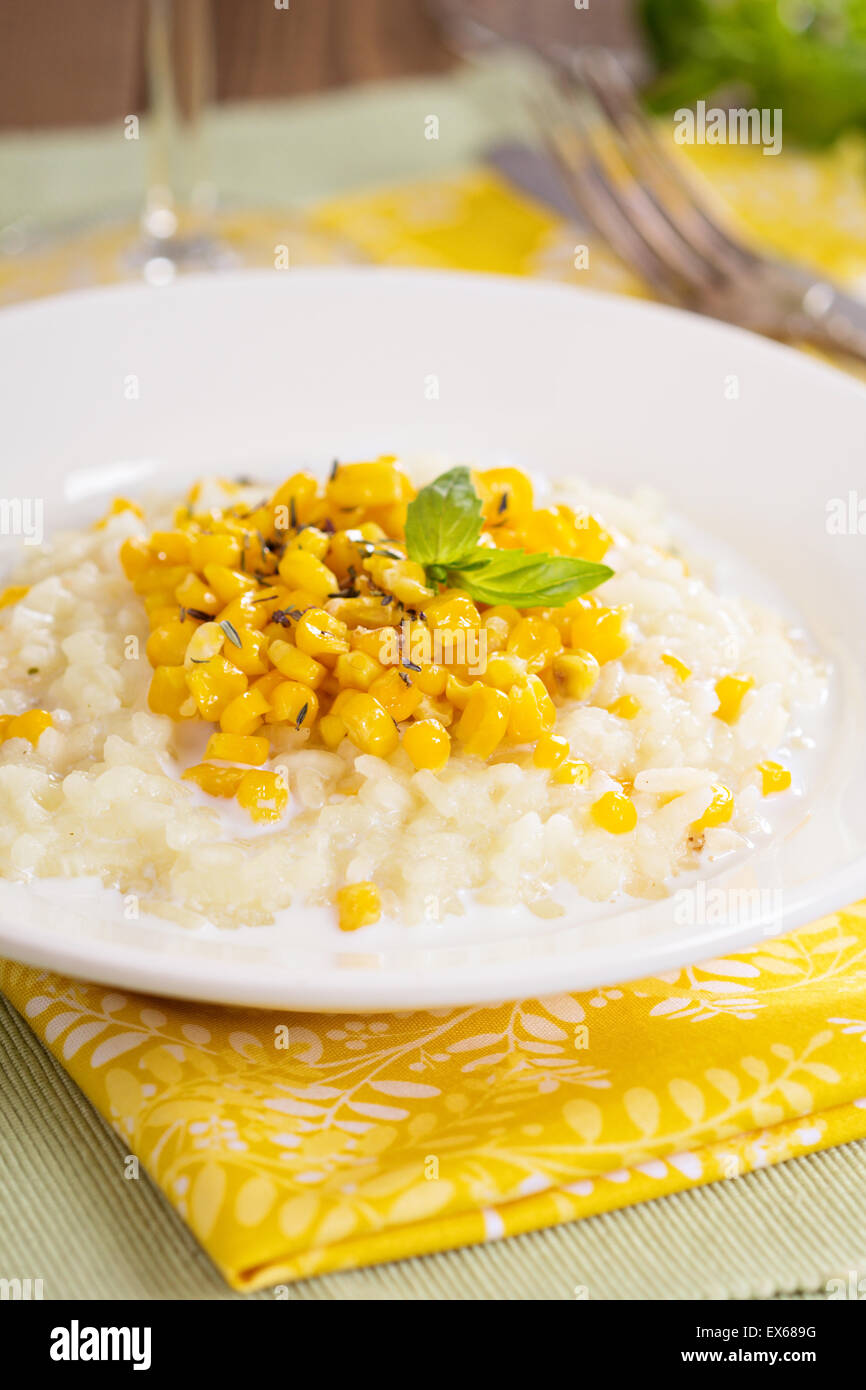 Vegan risotto with baked corn served on a plate Stock Photo