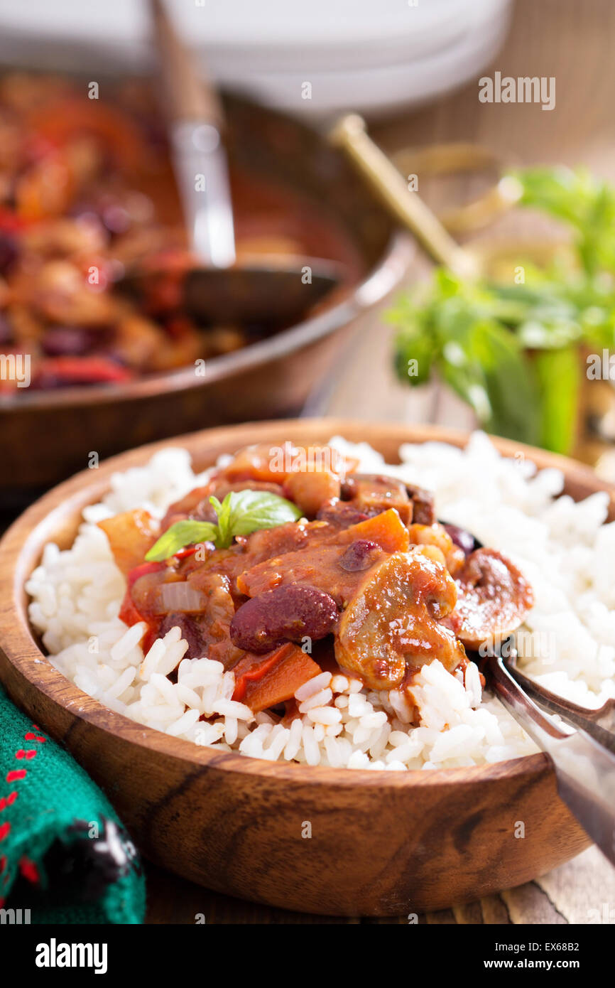 Vegan chili with beans, mushrooms, and vegetables served on rice Stock Photo