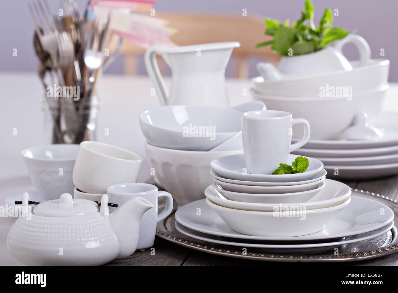 Variety of white dinnerware plates, cups and bowls Stock Photo Alamy