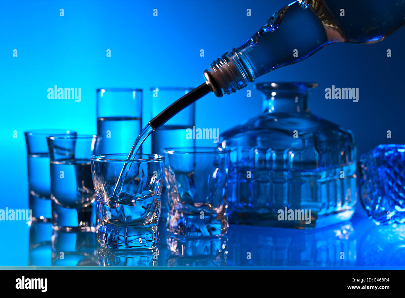alcoholic drinks in bar on a glass table Stock Photo - Alamy