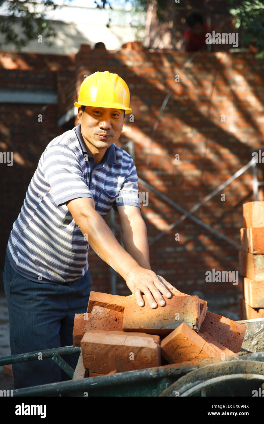 Portrait of construction worker at construction site Stock Photo - Alamy