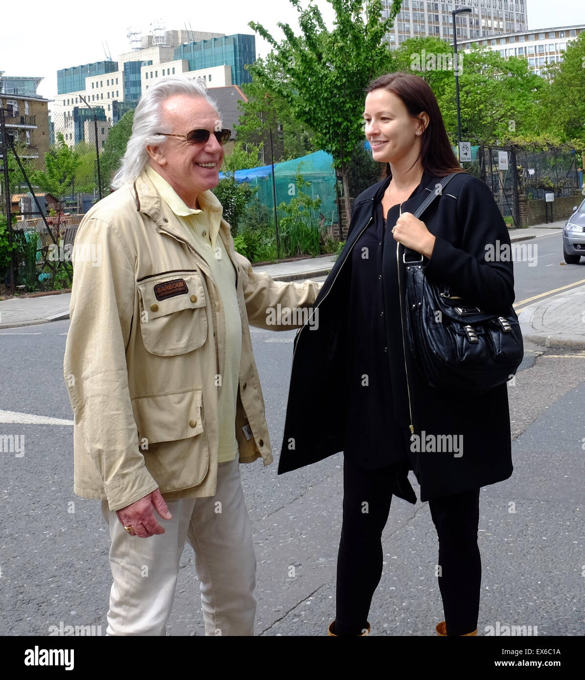 Peter Stringfellow and wife Bella Wright on their way back from casting their vote in Vauxhall. The couple reportedly said they had voted Conservative.  Featuring: Peter Stringfellow, Bella Wright Where: London, United Kingdom When: 07 May 2015 Stock Photo