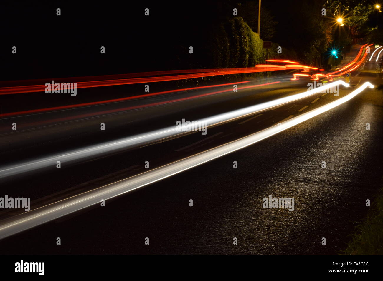 Long exposure image of cars going up and down a road. Stock Photo
