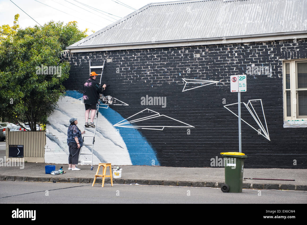 Artists painting a local wall in Melbourne, Australia Stock Photo Alamy
