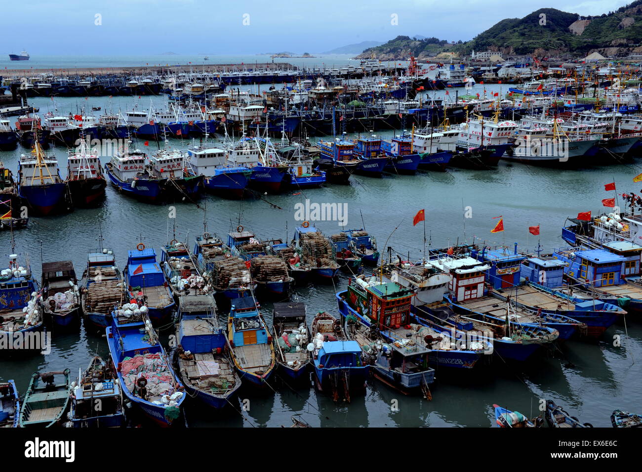 Fuzhou, China's Fujian Province. 8th July, 2015. Ships berth at Huangqi port  of Lianjiang County, southeast China's Fujian Province, July 8, 2015. China  activated an emergency response mechanism for potential damage from