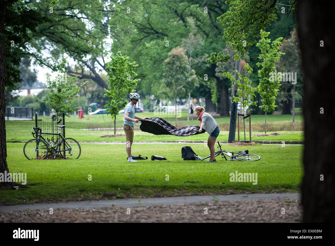 Edinburgh Gardens scene, two cyclists preparing for picnic Stock Photo