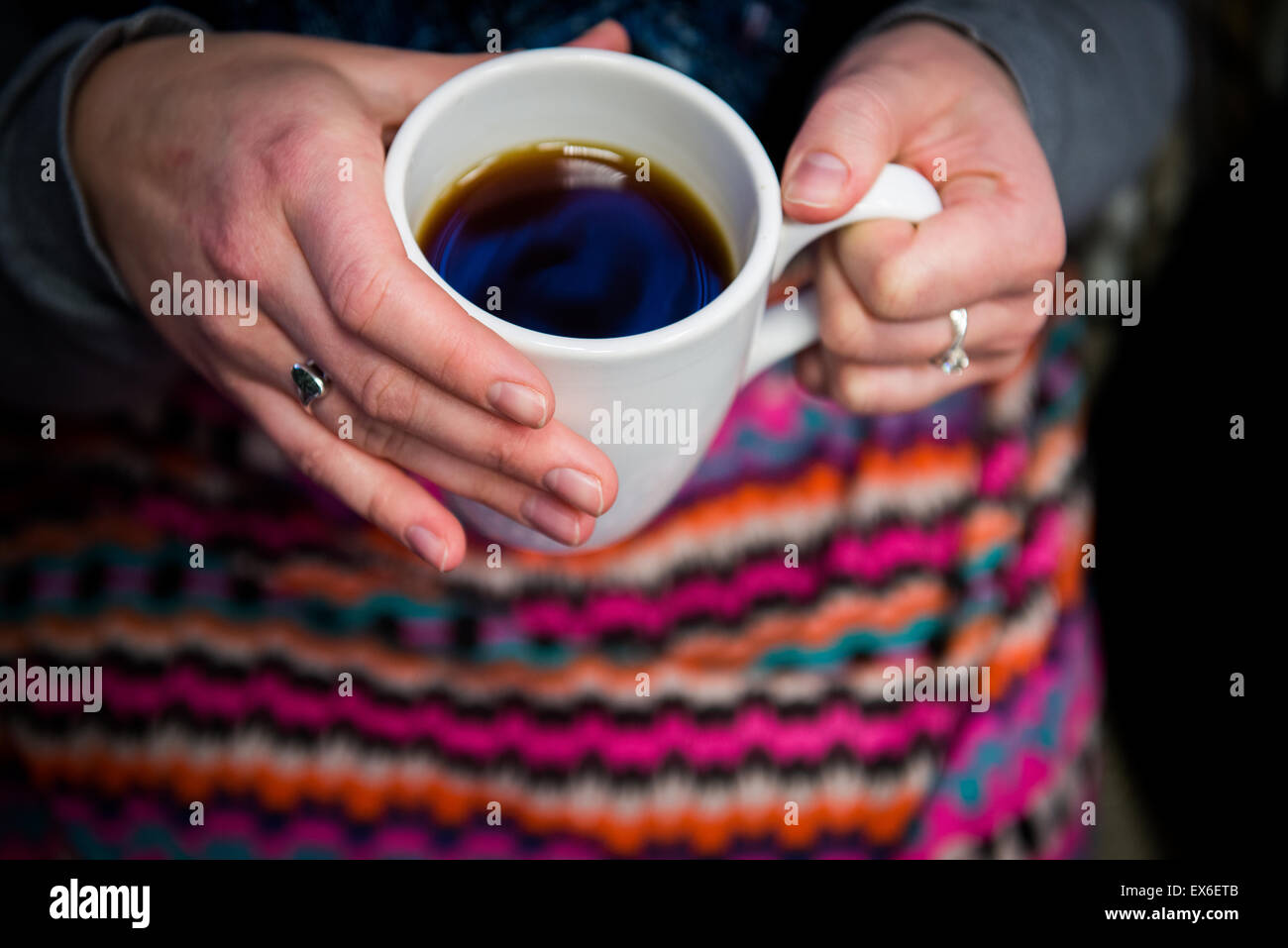 Girl drinking cup of tea and talking Stock Photo Alamy