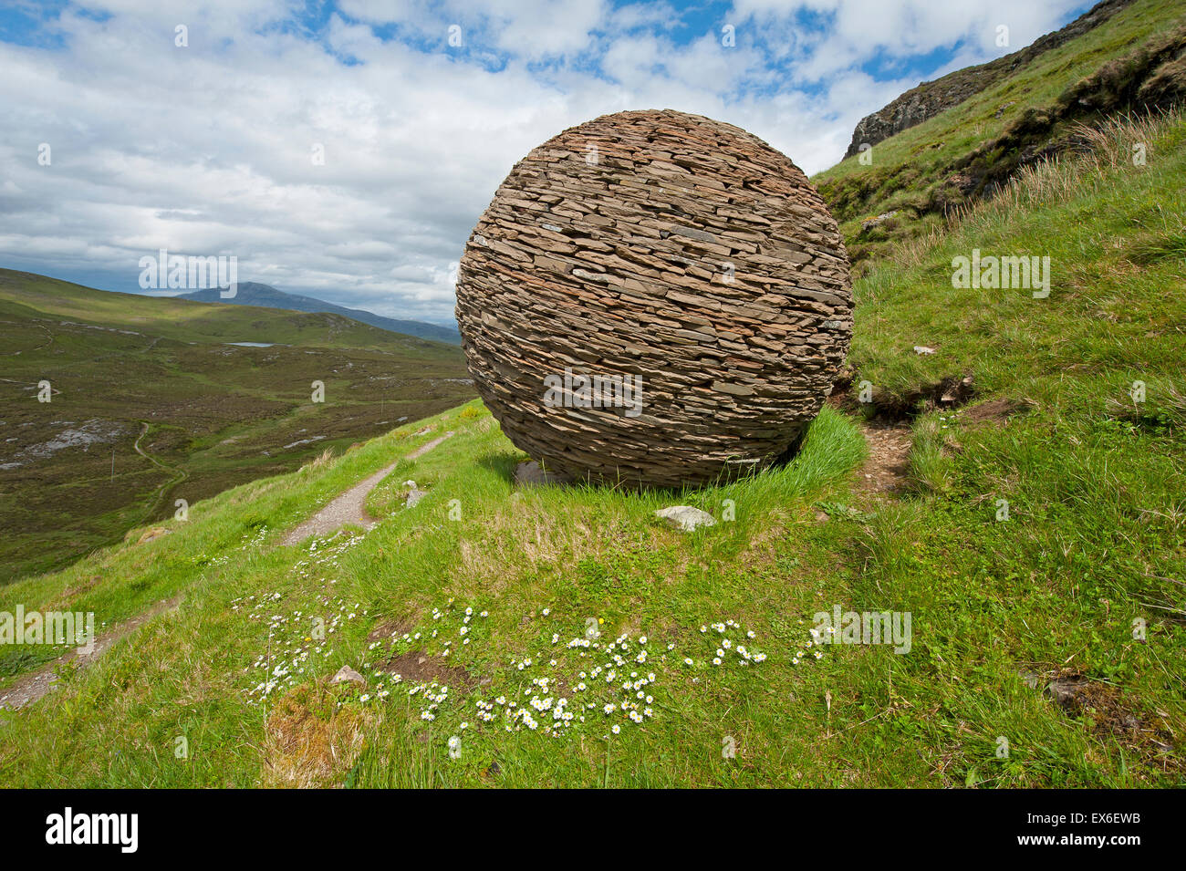 Cul Mor and the Globe artwork made by Joe Smith from Moine Shist at Knockan Crag, NW Scotland.  SCO 9908. Stock Photo