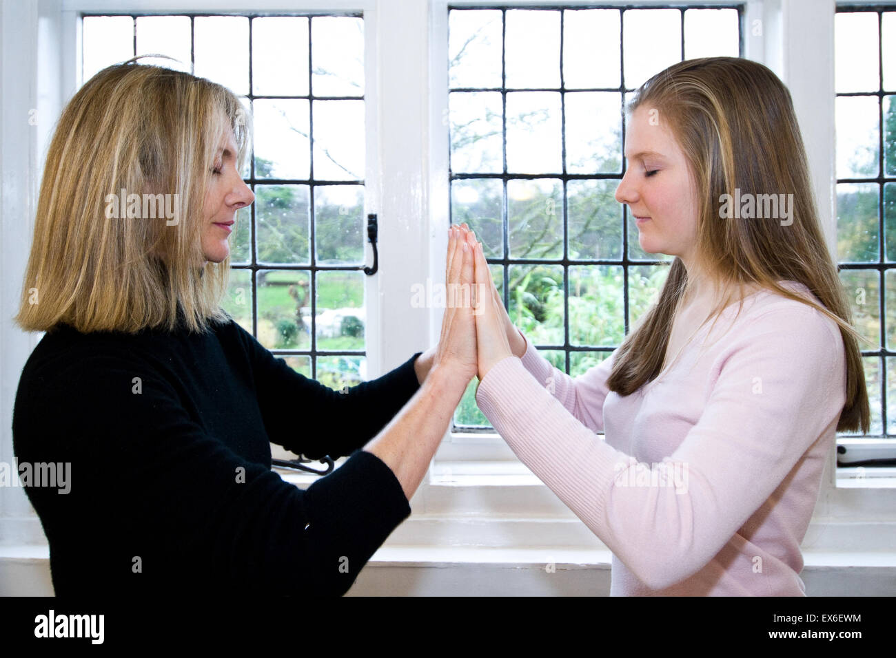 Mother and daughter doing Qigong at a class Stock Photo Alamy