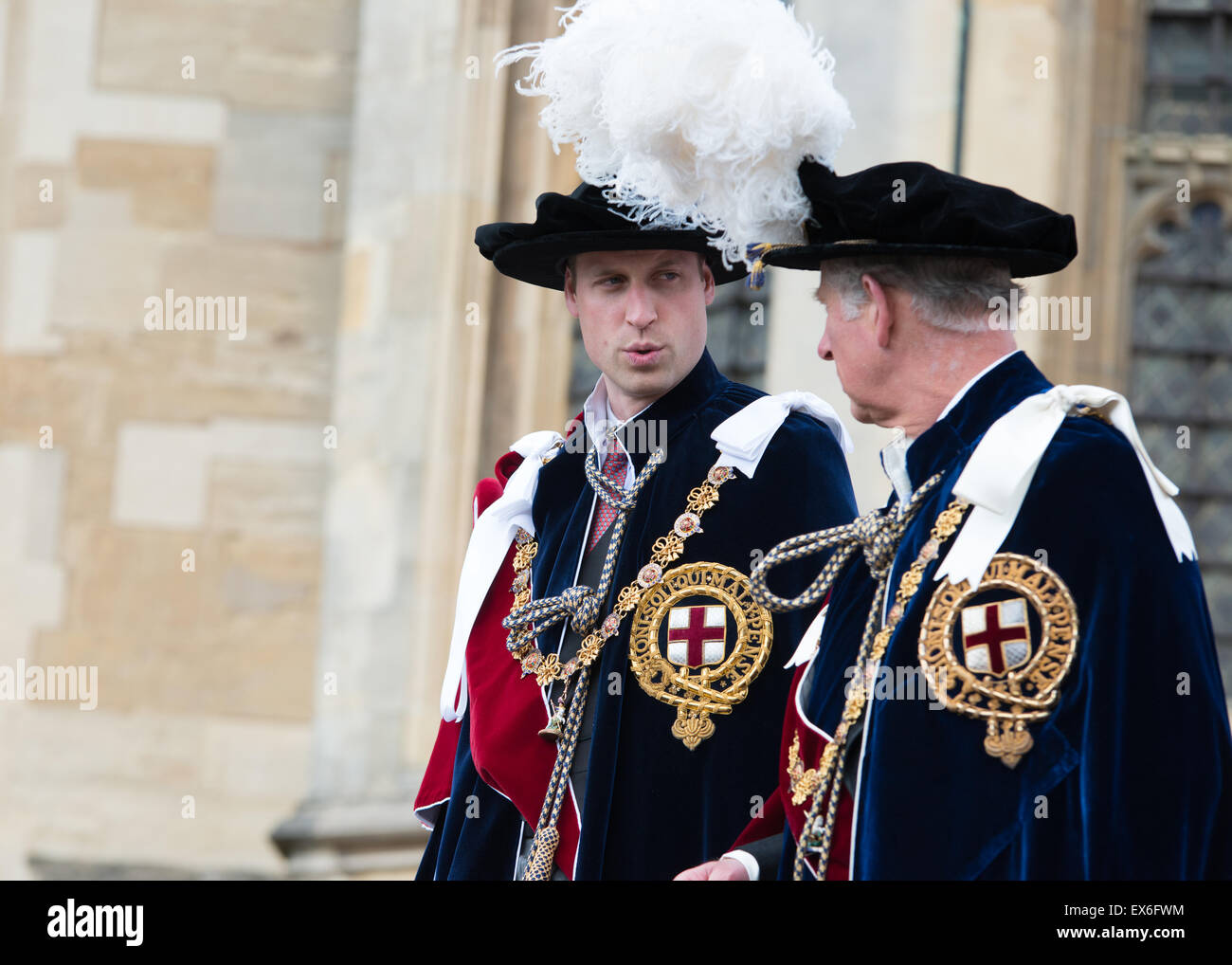 Prince Andrew talking toPrince Edward, Prince Charles and Prince William in the background wearing the Garter robes Stock Photo