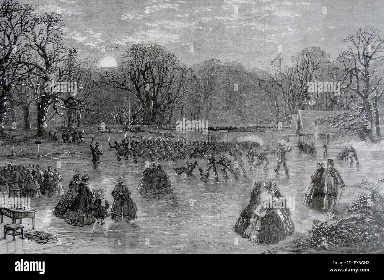 Engraving titled 'Skating of the Serpentine by Torchlight' depicting crowds of wealthy people skating of the frozen Serpentine River, British Columbia, Canada. Dated 1859 Stock Photo