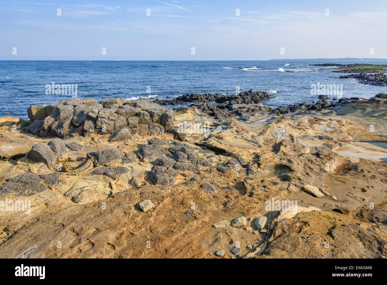 Coast of Jeju island with unusual Volcanic rocks Stock Photo