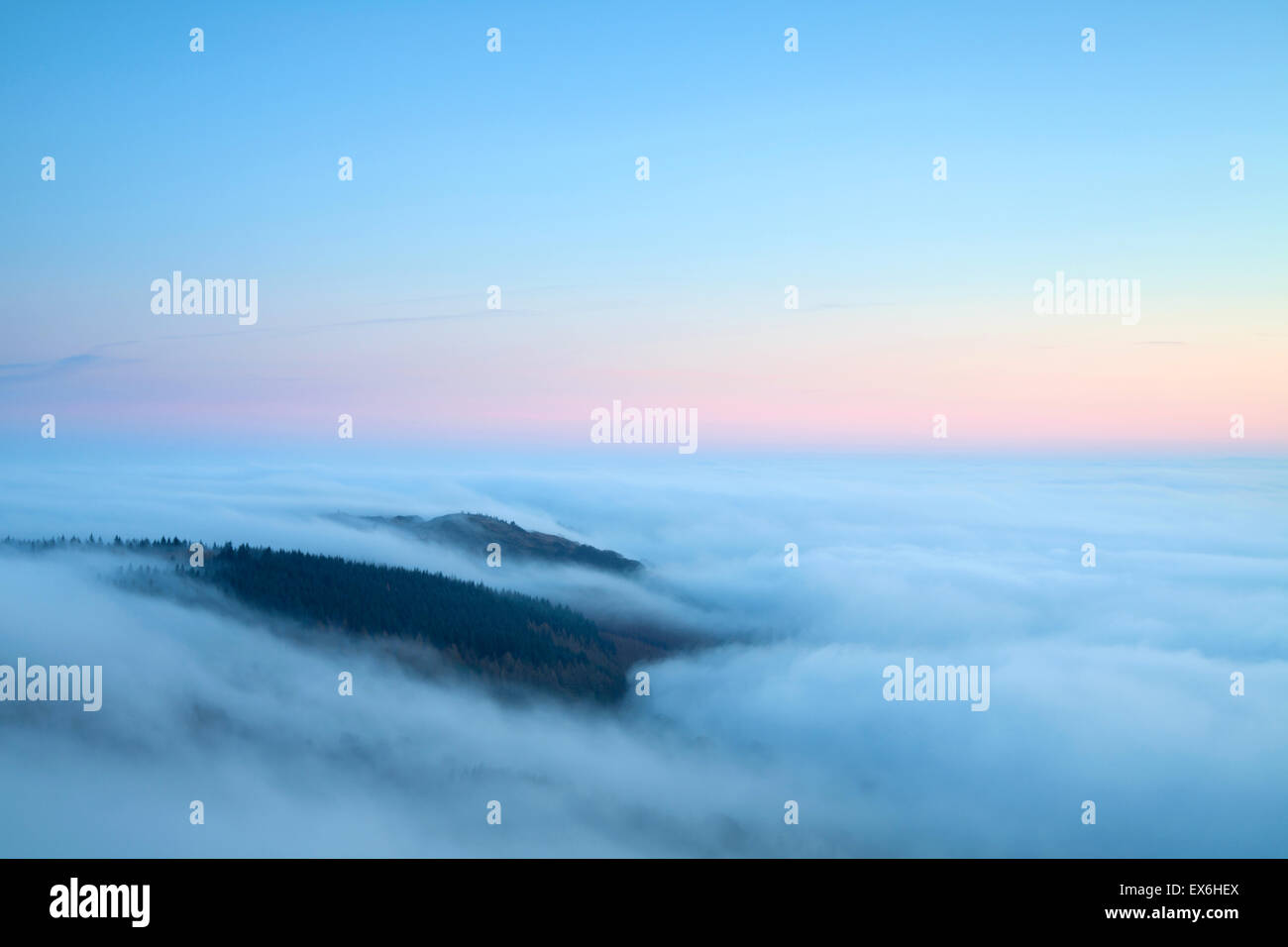 Cloud inversion at sunset over Gummers How Lake District UK Stock Photo