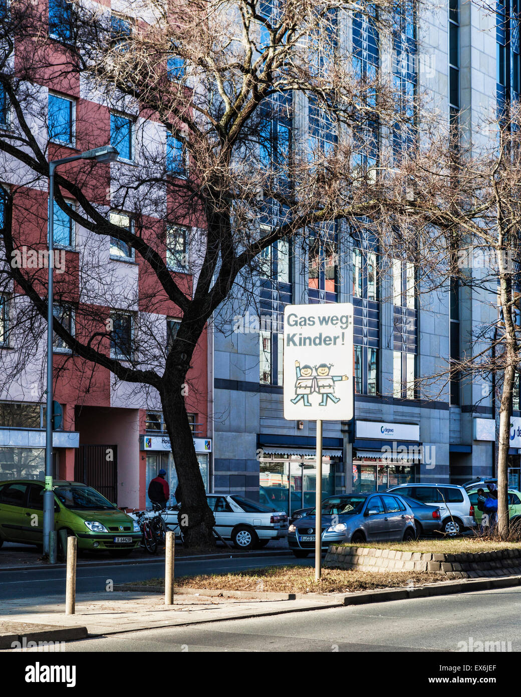 Berlin street view - apartment buildings, tree and beware children crossing sign Stock Photo