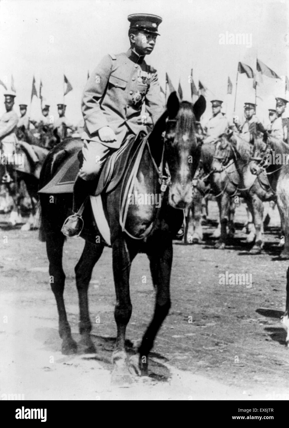 Emperor Hirohito of Japan on horseback, reviewing troops of the Japanese Army 1928 Stock Photo