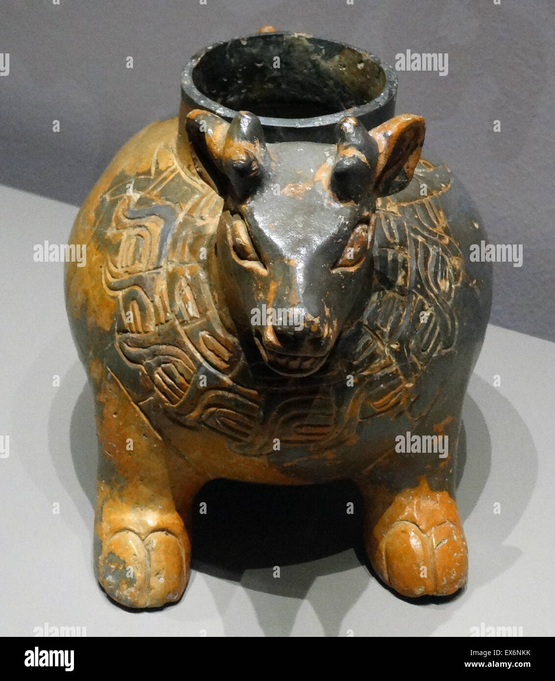 A zoomorphic pot from Mexico. The animal represented on this one is produced in a realistic manner and has a breastplate with evident religious symbolism displayed on it. Produced in the coastal region of Chiapas and Guatemala where it was imported from. Stock Photo