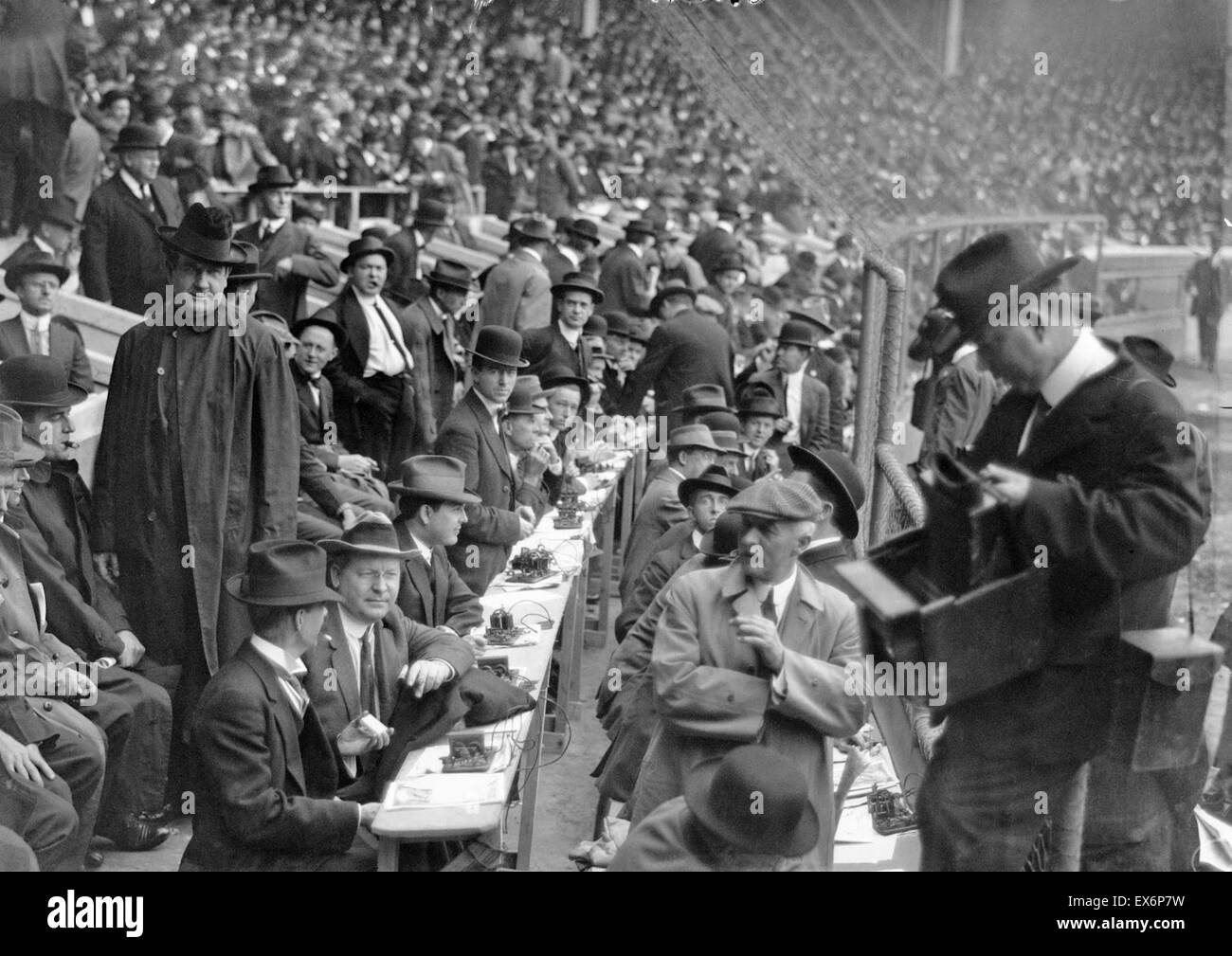 American sports journalists at a baseball match with telegraph sets ready to transmit the score. 1915 Stock Photo