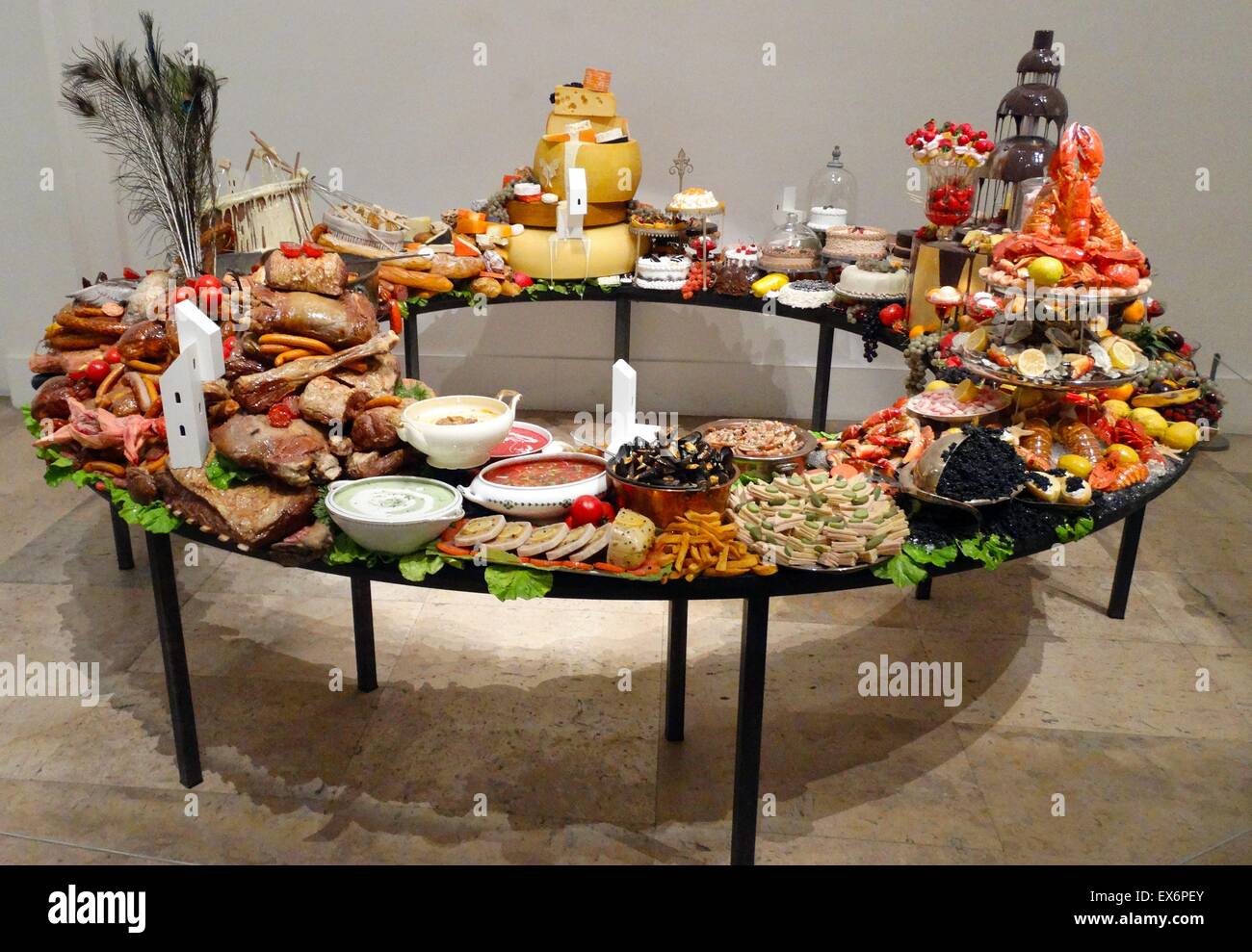 Sculpture titled 'Le Festin III' by Gilles Barbier (1965-) Ni-Vanuatu Contemporary artist. Oil painting on synthetic resin, cookware and table. Dated 2014 Stock Photo