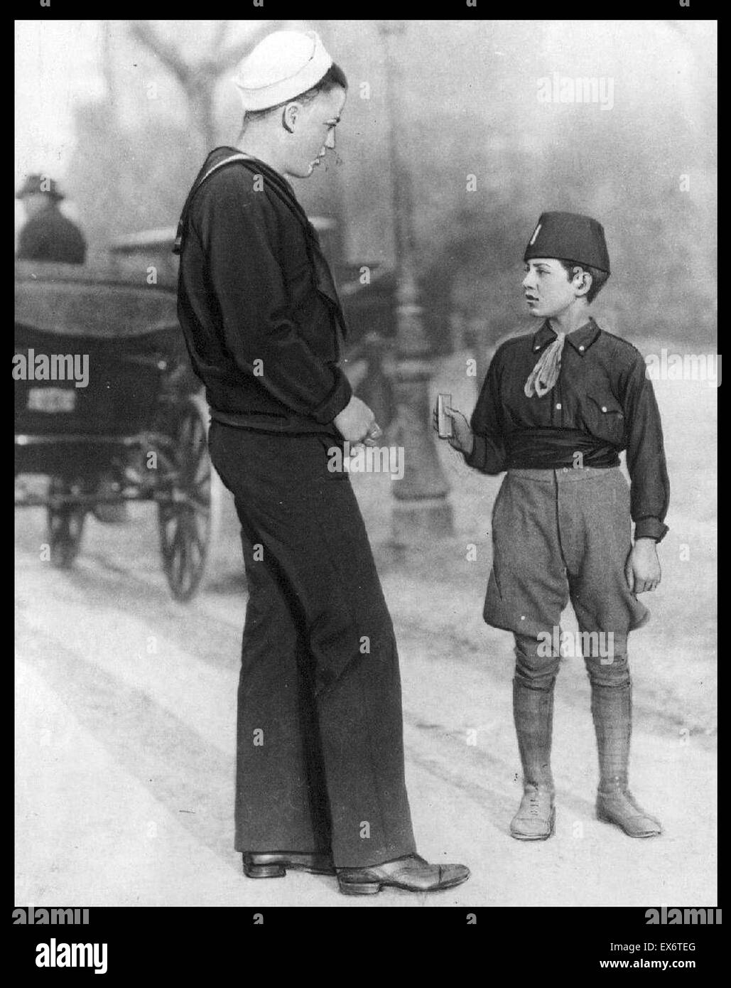 Fascist youth boy greeting an Italian sailor 1930's Stock Photo