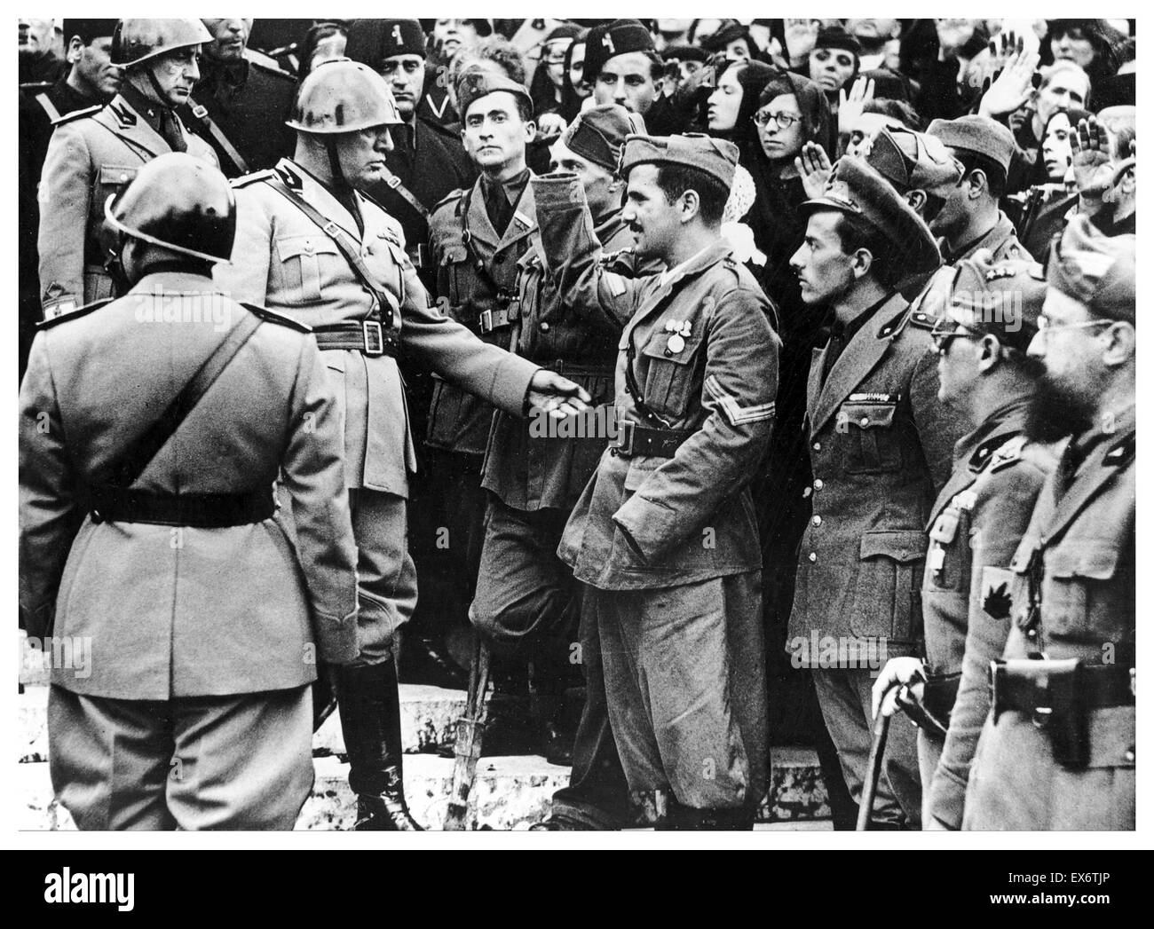 Benito Mussolini (1883 – 28 April 1945) Italian politician, journalist, and leader of the National Fascist Party greeting war veterans circa 1939 Stock Photo