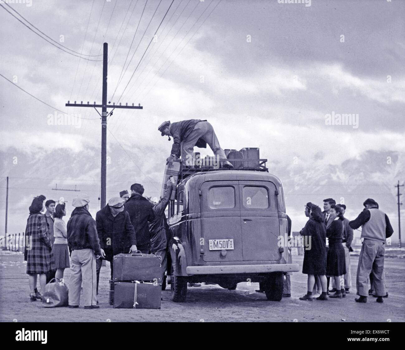 Photographic print of a loading bus leaving Manzanar for relocation, Manzanar Relocation Centre, California. Photographed by Ansel Adams (1902-1984). Dated 1943 Stock Photo