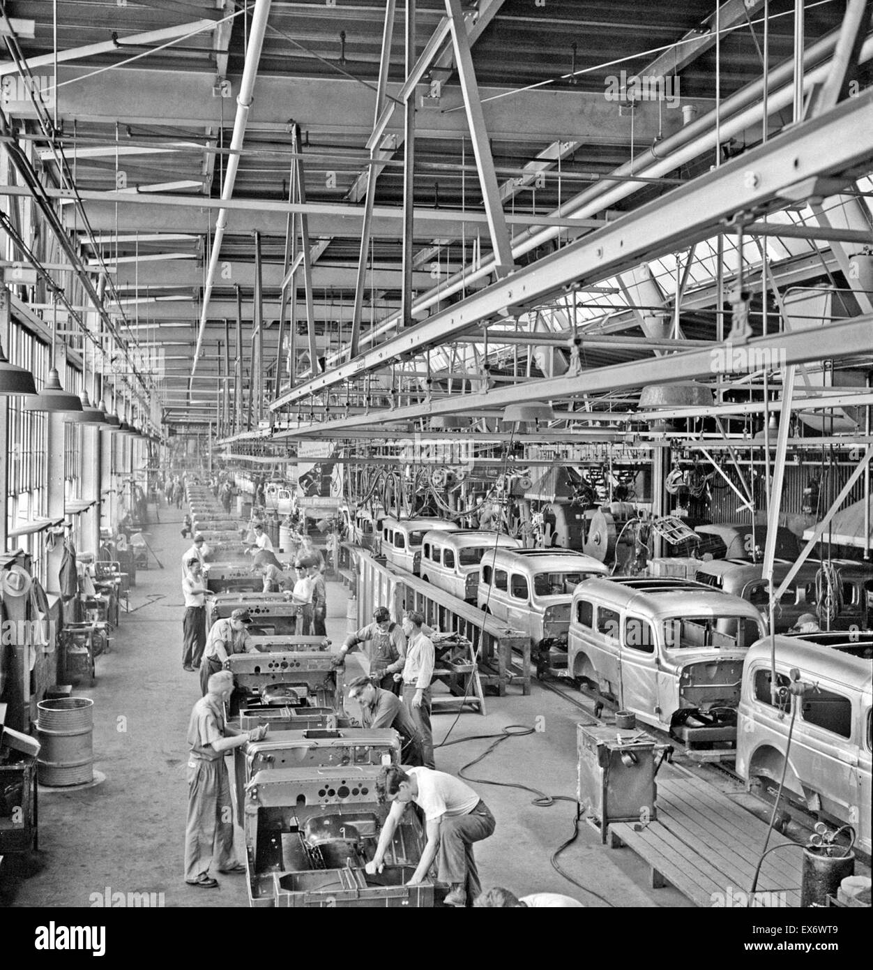 Detroit, Michigan. A steady stream of bodies for Dodge Army trucks receive important finishing operations along this section of the production line, 1942. Stock Photo