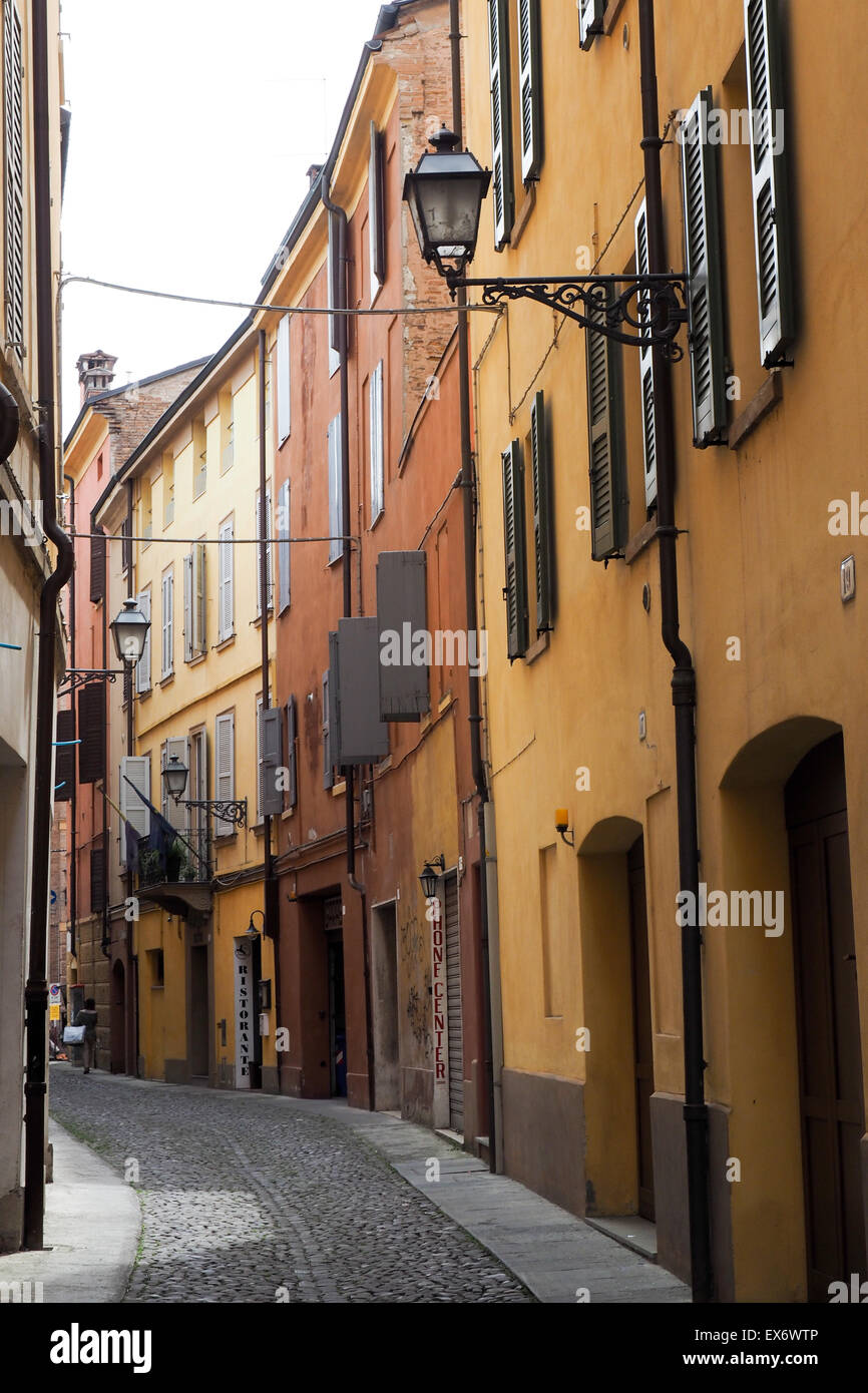 Narrow cobblestoned street in Modena, Italy. Stock Photo