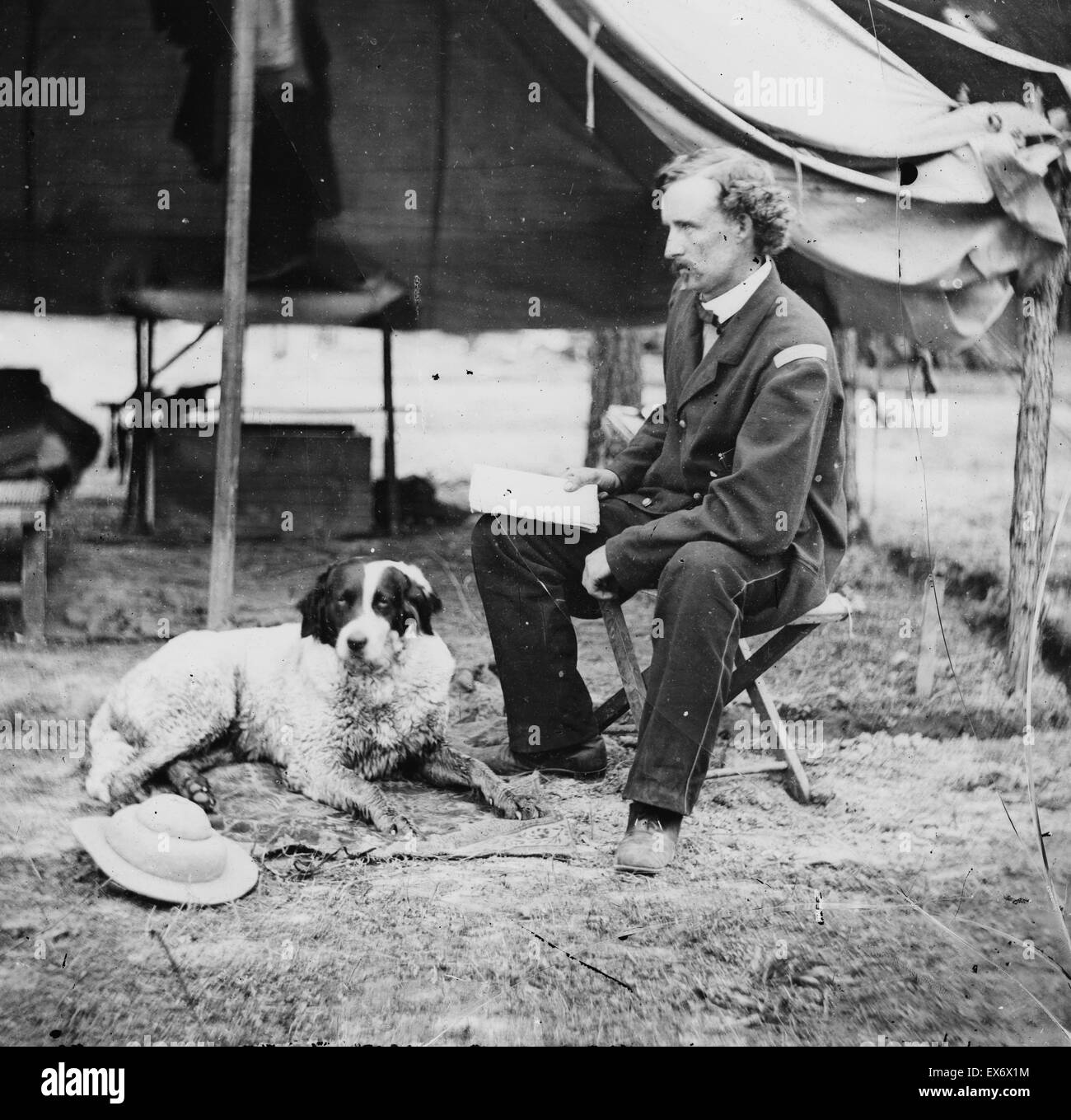 Photographic print of Cavalry Commander George Armstrong Custer (1839-1876) with his dog during the American Civil War. Raised in Michigan and Ohio, Custer was admitted to West Point in 1858, where he graduated last in his class. With the outbreak of the Stock Photo