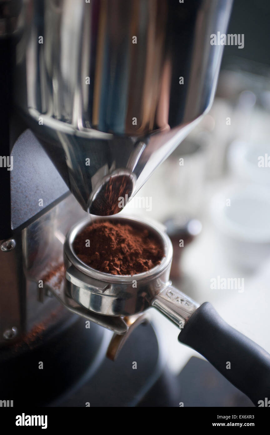 Filling portafilter basket with ground coffee Stock Photo Alamy
