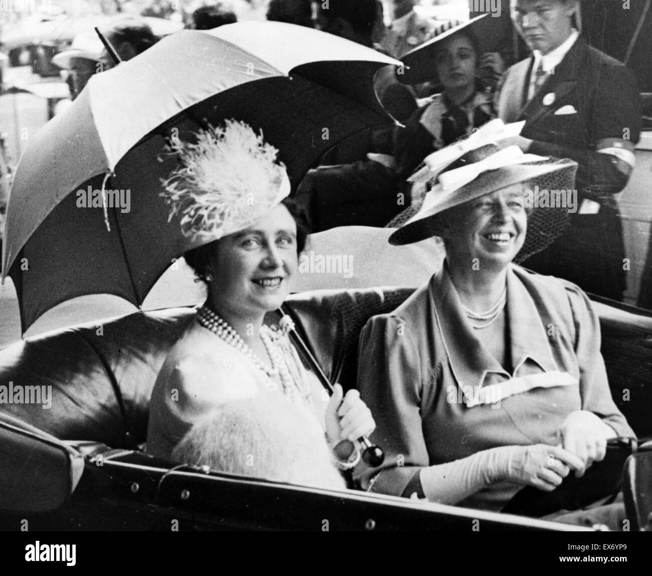 Mrs. Eleanor Roosevelt and Queen Elizabeth, holding umbrella, in automobile, leaving station for the White House 1939. Stock Photo