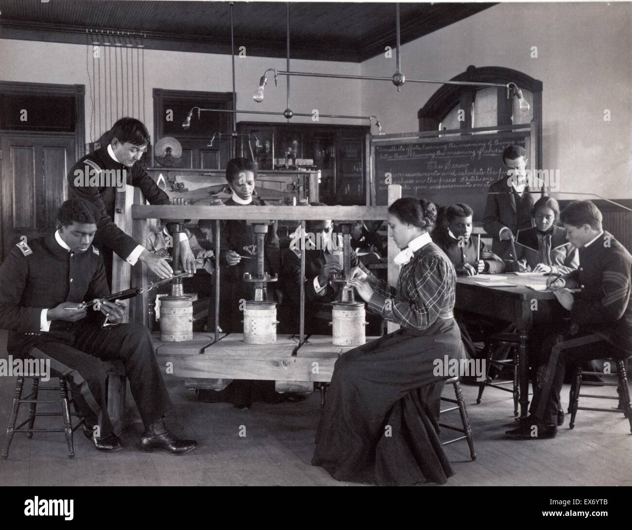 The cheese press screw - students studying agricultural sciences, Hampton Institute, Hampton, Virginia. 1900 Stock Photo