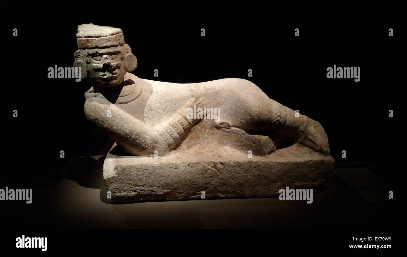 Chacmool (Chacmool) form of pre-Columbian, Mesoamerican sculpture, depicting a reclining figure with its head facing 90 degrees from the front, supporting itself on its elbows and supporting a bowl or a disk upon its stomach. These figures possibly symbol Stock Photo