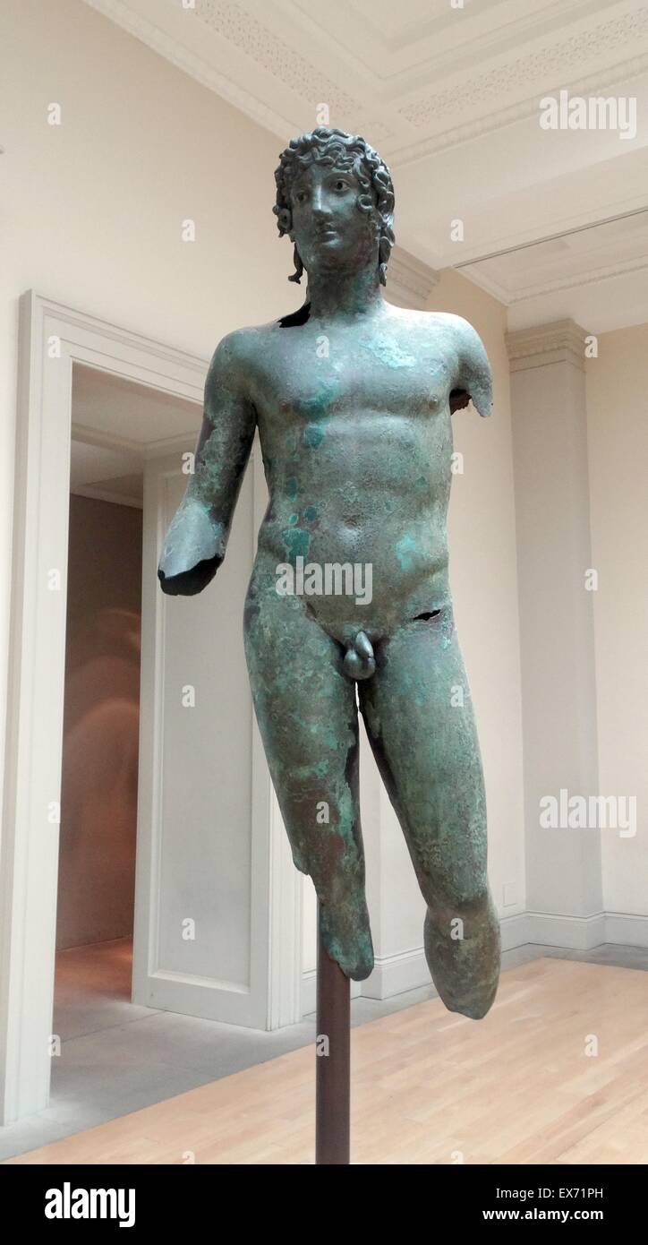 Bronze statue of a young man In ancient Greece and Rome. The figure is