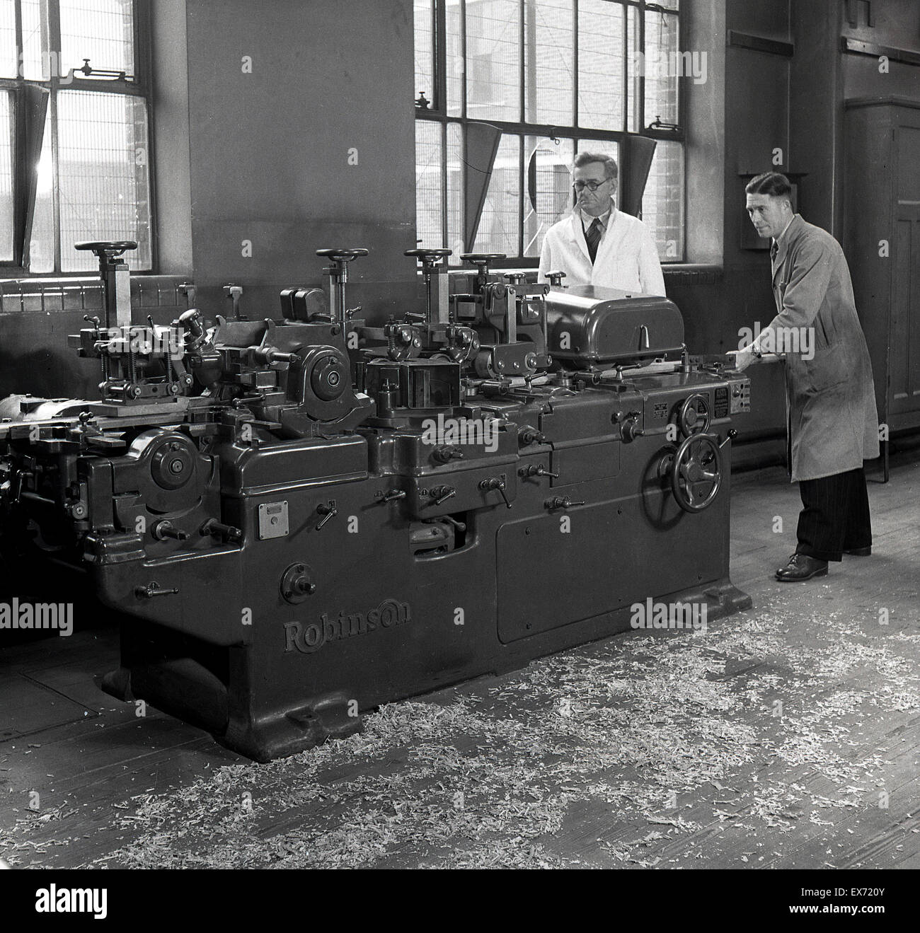 historical, 1950s, engineers working with a large lathe Stock Photo Alamy