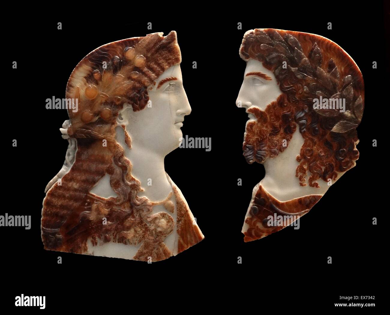 Sardonyx cameo busts of two members of the Roman Imperial family, depicted as Jupiter Ammon and Juno or Isis. About AD 37-50. The woman resembles the princesses of the imperial houses of Gaius (Caligula, AD 37-41) or Claudius (AD 41-54). The male figure i Stock Photo