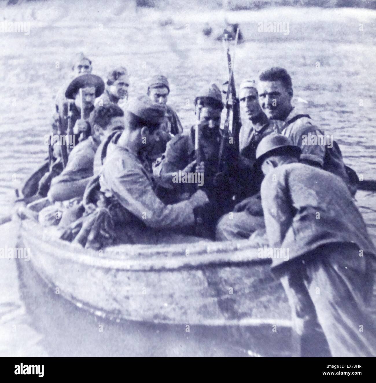 Republican soldiers cross the Erbo River during the Battle of the Ebro, the longest and largest battle of the Spanish Civil War. It took place between July and November 1938, with fighting mainly concentrated in two areas on the lower course of the Ebro R Stock Photo
