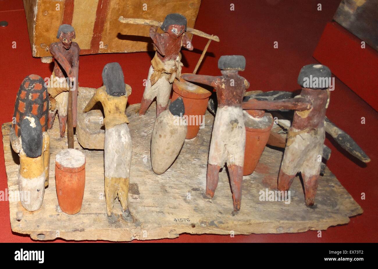 Ancient Egyptian painted wooden model representing baking, brewing and