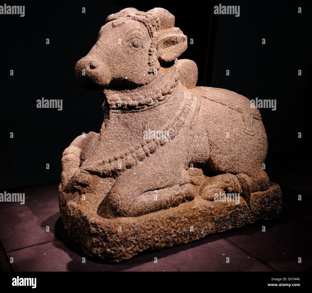 Figure of Nandi, India, Deccan, 1500's AD, Carved granite. The humped bull Nandi (which means rejoicing) appears at the entrance of every temple dedicated to the Hindu god Shiva Stock Photo