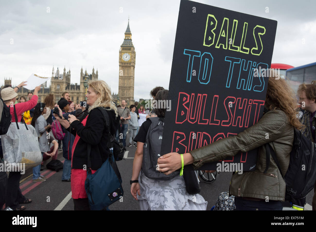 London, UK. 8th July, 2015. Protesters against Chancellor George Osbourne's budget come together in a demonstration they call 'Balls to the budget'. Anti-austerity and disability campaigners released multi-coloured balls into Whitehall outside Downing Street in protest at what they see as a budget which persecutes and demonises benefit claimants, then marched past Parliament and blocked Westminster Bridge Credit:  Patricia Phillips/Alamy Live News Stock Photo