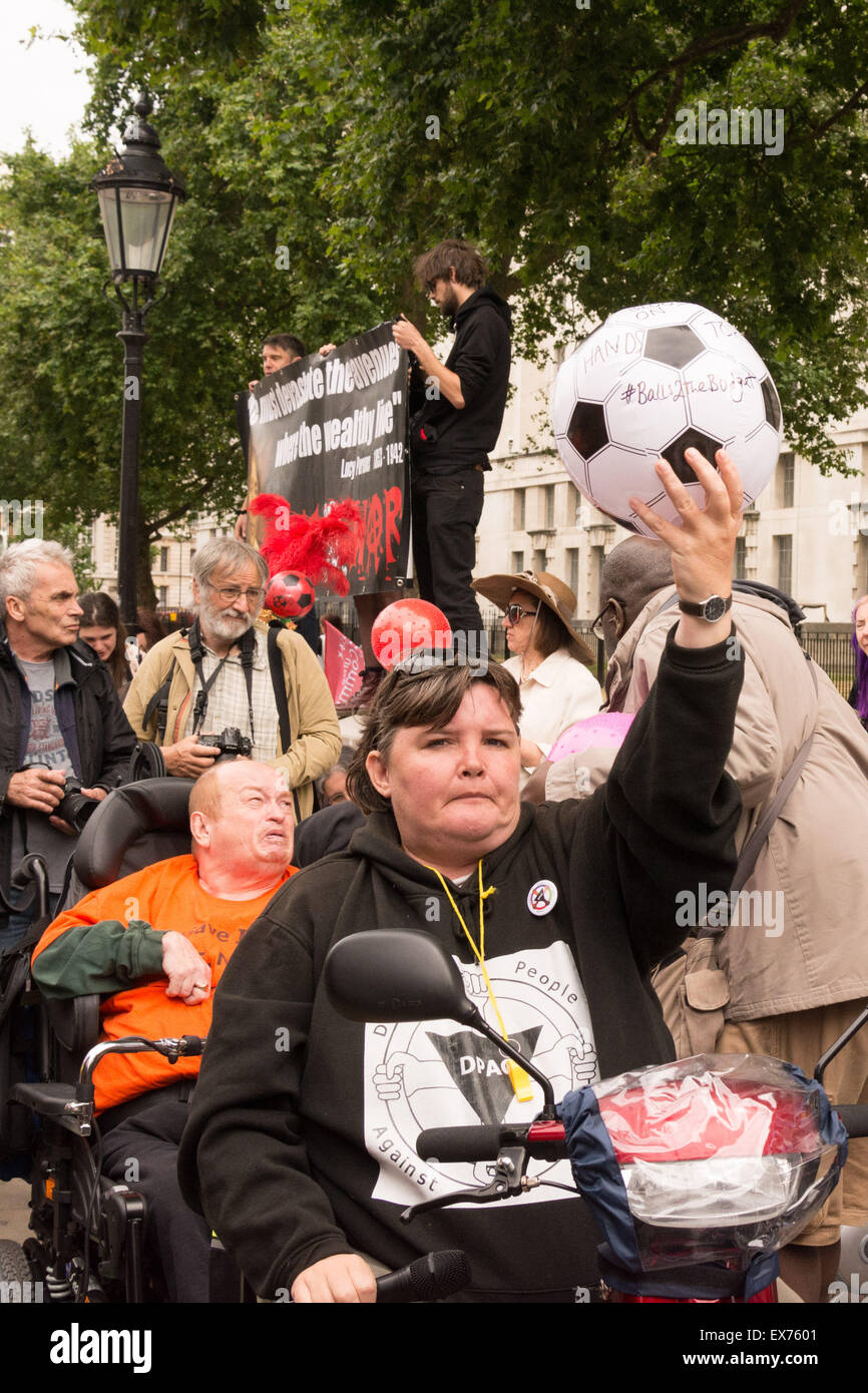 London, UK. 8th July, 2015. Protesters against Chancellor George Osbourne's budget come together in a demonstration they call 'Balls to the budget'. Anti-austerity and disability campaigners released multi-coloured balls into Whitehall outside Downing Street in protest at what they see as a budget which persecutes and demonises benefit claimants, then marched past Parliament and blocked Westminster Bridge Credit:  Patricia Phillips/Alamy Live News Stock Photo
