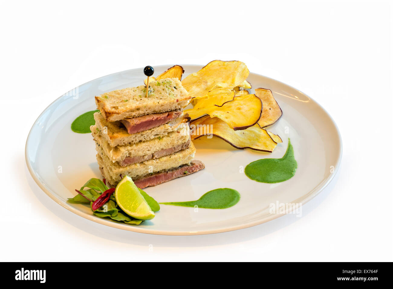 Tuna fish steak sandwich with seaweed butter and green curry sauce