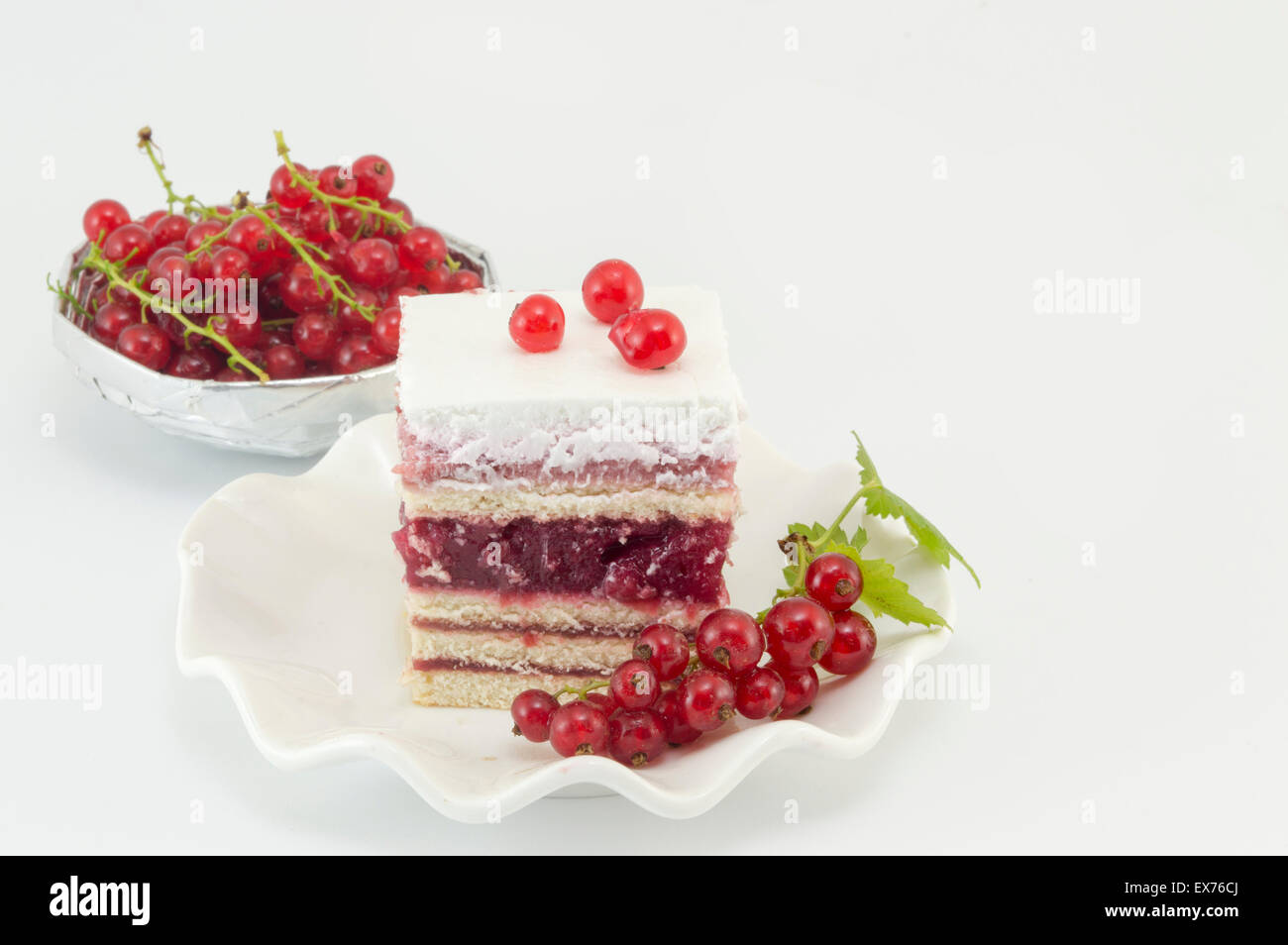 Homemade fruit cake with currant and fresh currant fruit on white background Stock Photo