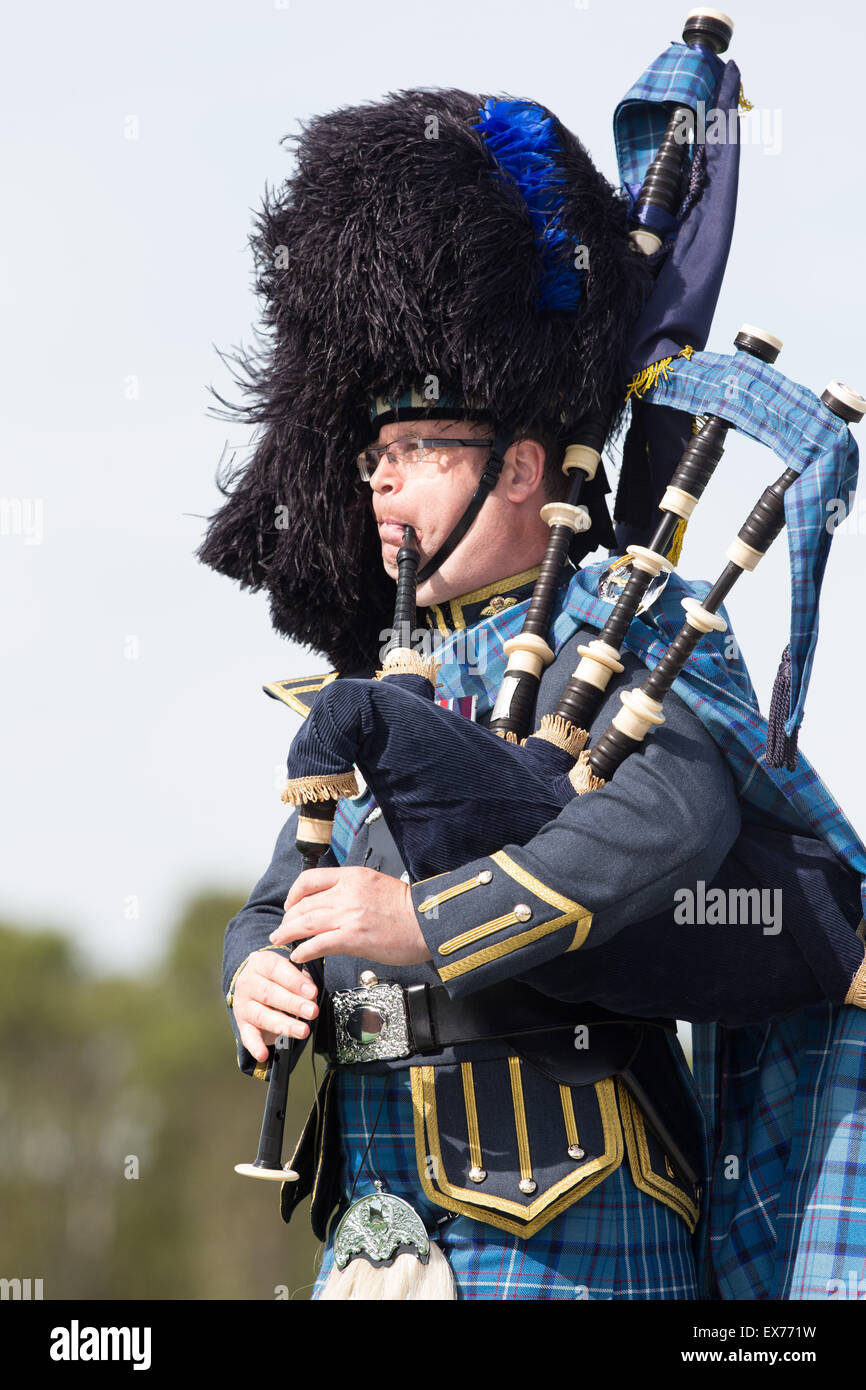 A Scottish piper at the Barry Buddon Shooting Centre during the Glasgow Commonwealth Games in Scotland on July 28, 2014 Stock Photo