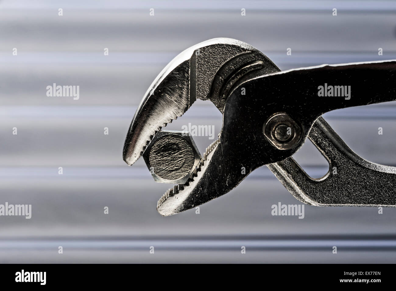 Water pump or gas pliers clamped onto a bolt Stock Photo Alamy